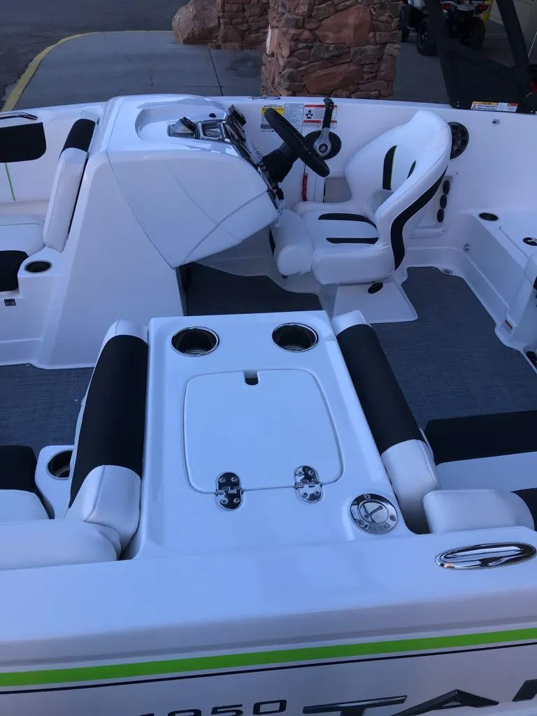 Slide: The Image of 2024 Tahoe 1950 boat interior with seating and steering console. - 20