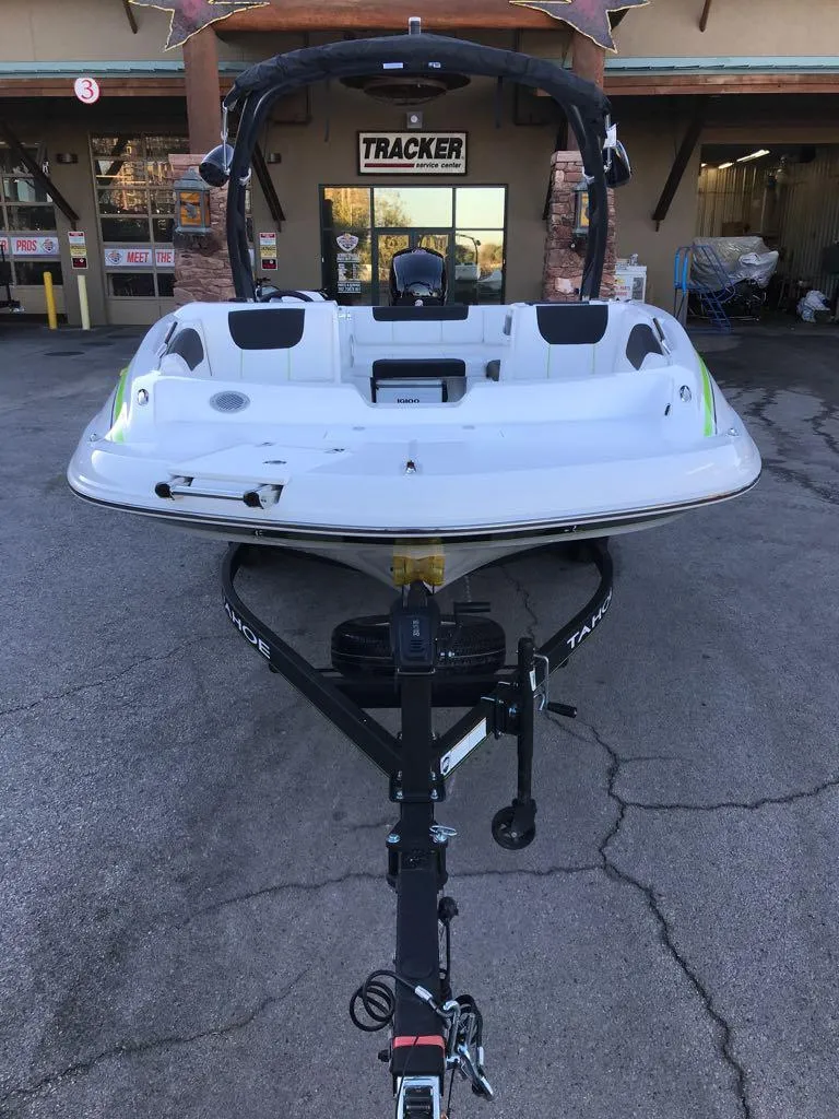 Slide: The Image of 2024 Tahoe 1950 boat on trailer outside Tracker store. - 7