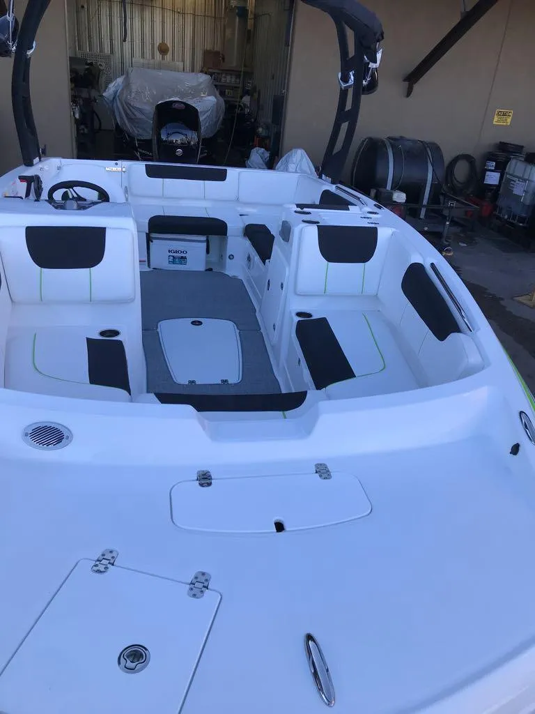 Slide: The Image of 2024 Tahoe 1950 boat interior with seating and storage compartments. - 8