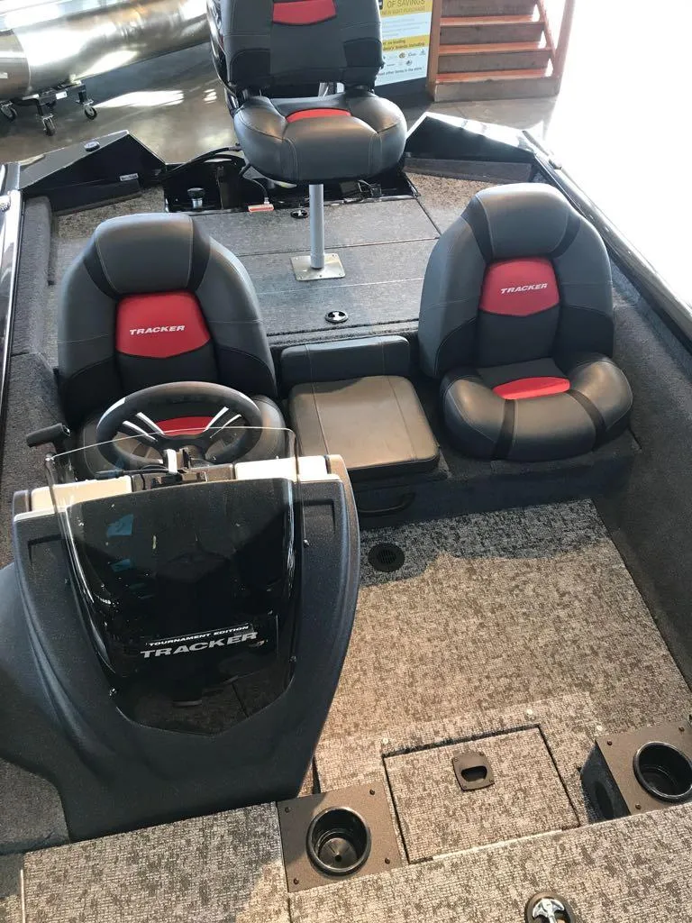 Slide: The Image of 2025 Tracker Pro Team 175 boat interior with seating and steering console. - 10