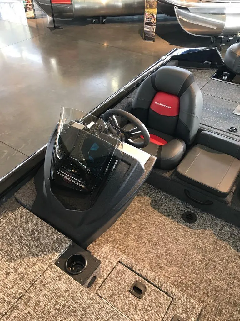 Slide: The Image of 2025 Tracker Pro Team 175 boat interior with steering console and seating. - 11