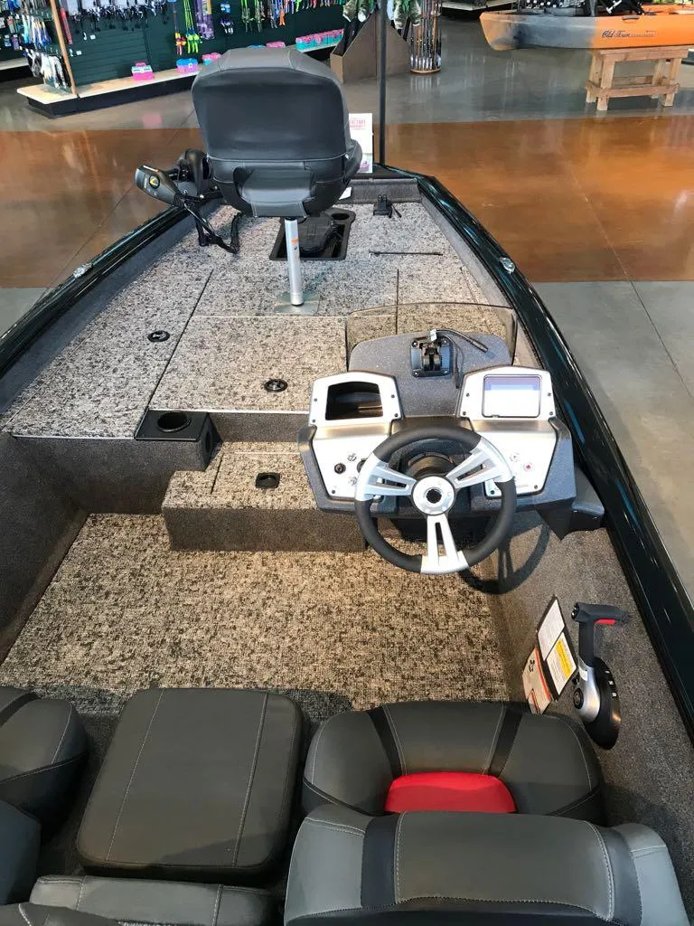 Slide: The Image of 2025 Tracker Pro Team 175 boat interior with steering wheel and seating. - 5