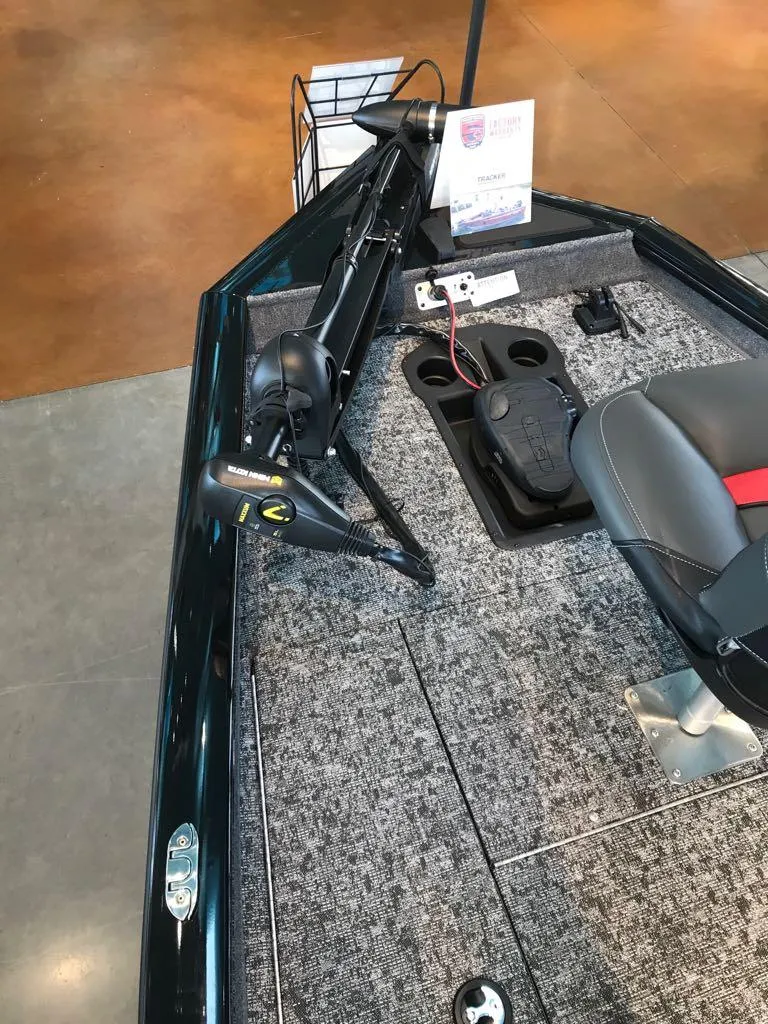 Slide: The Image of 2025 Tracker Pro Team 175 boat interior with trolling motor and seating. - 7