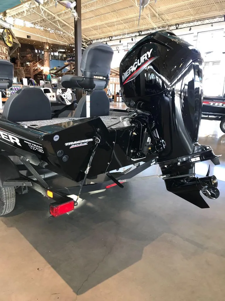 Slide: The Image of 2025 Tracker Pro Team 175 boat with Mercury engine in showroom. - 8