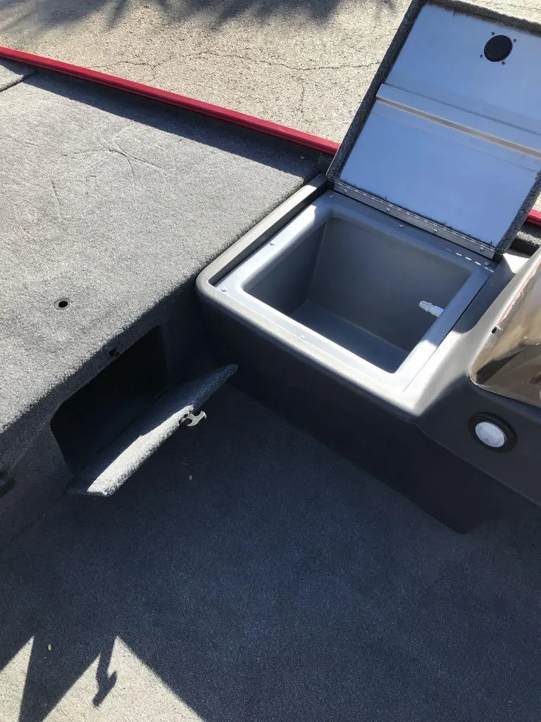 Slide: The Image of 2025 Tracker Bass Tracker Classic XL boat displayed in showroom with Mercury engine. - 12