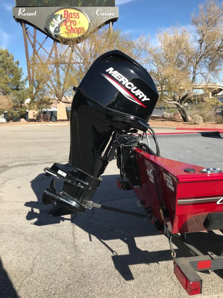 Slide: The Image of 2025 Tracker Bass Tracker Classic XL boat on trailer, parked outside a building. - 4