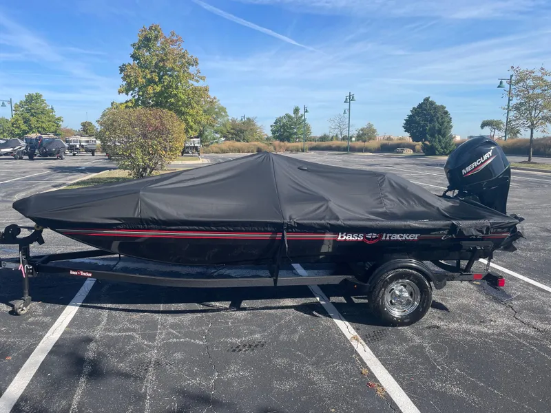 Slide: The Image of 2025 Tracker Bass Tracker Classic XL boat covered in parking lot. - 3