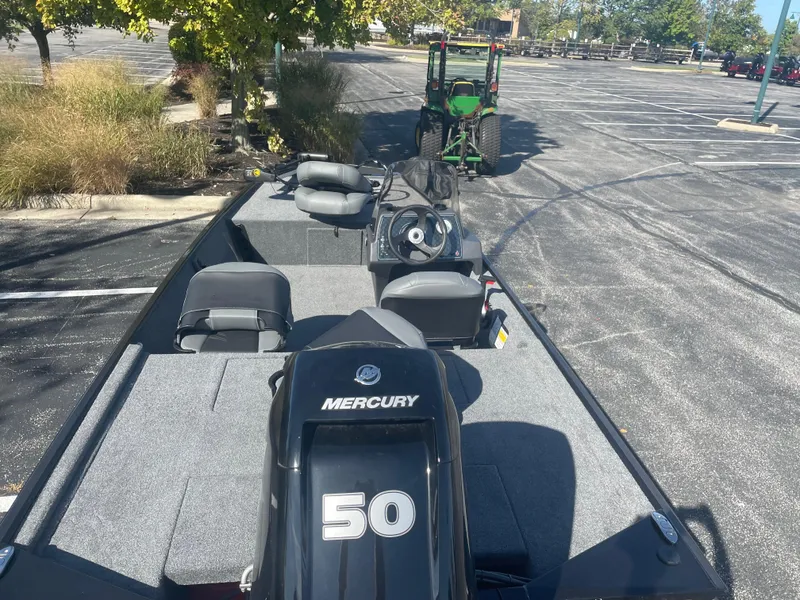 Slide: The Image of 2025 Tracker Bass Tracker Classic XL boat with Mercury 50 engine in parking lot. - 5