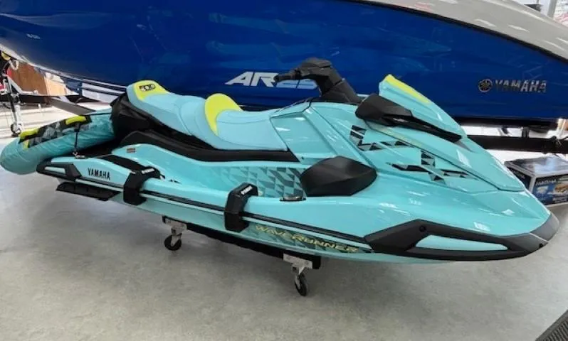 Slide: The Image of 2025 Yamaha WaveRunner VX Limited Ho in vibrant turquoise on display. - 0