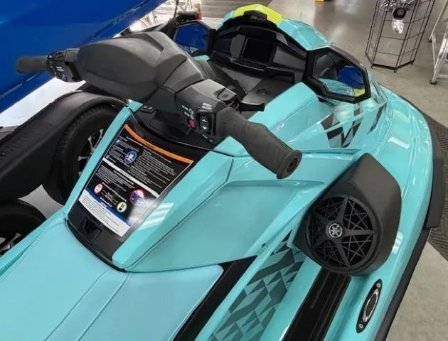 Slide: The Image of 2025 Yamaha WaveRunner VX Limited Ho, turquoise, close-up of handlebars and dashboard. - 2