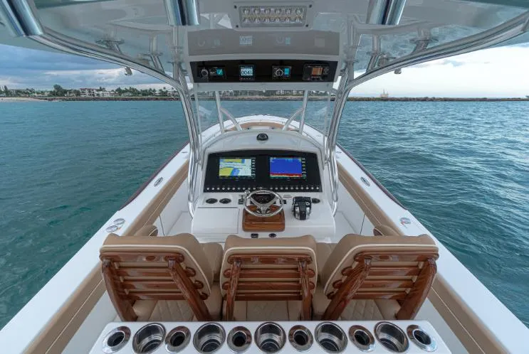 Slide: The Image of Valhalla Boatworks V 37, 2025 model, helm view with advanced navigation system. - 6
