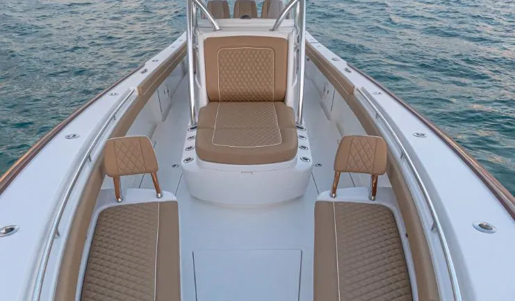 Slide: The Image of 2025 Valhalla Boatworks V 37 interior with tan seating on the water. - 8