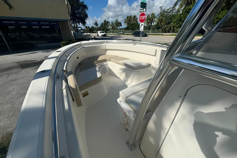 Slide: The Image of 2025 Bulls Bay 255CC boat interior with seating and clear skies. - 8