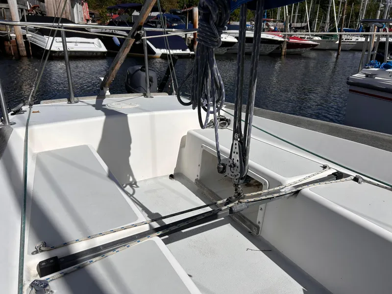 Slide: The Image of 1991 J Boats J/22 sailboat cockpit with rigging, docked at marina. - 13
