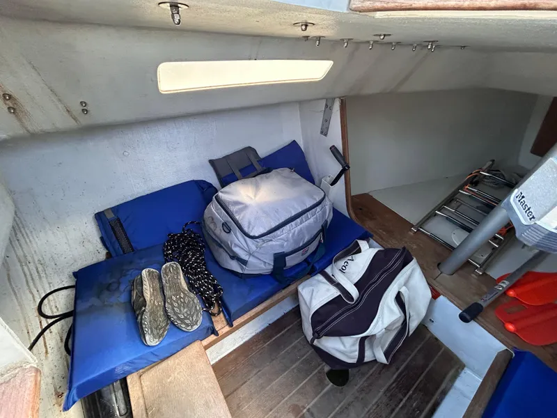 Slide: The Image of Interior of 1991 J Boats J/22 sailboat with bags and gear. - 21