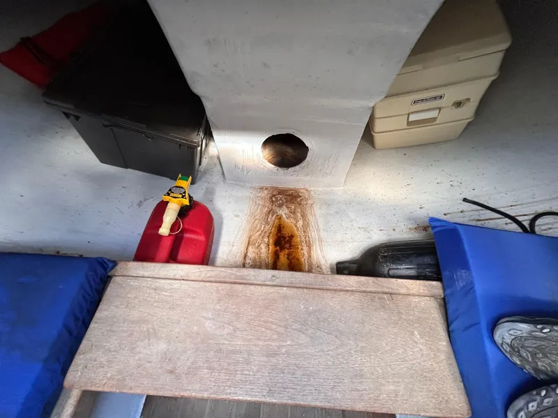 Slide: The Image of Interior of a 1991 J Boats J/22 sailboat with storage compartments and seating. - 24