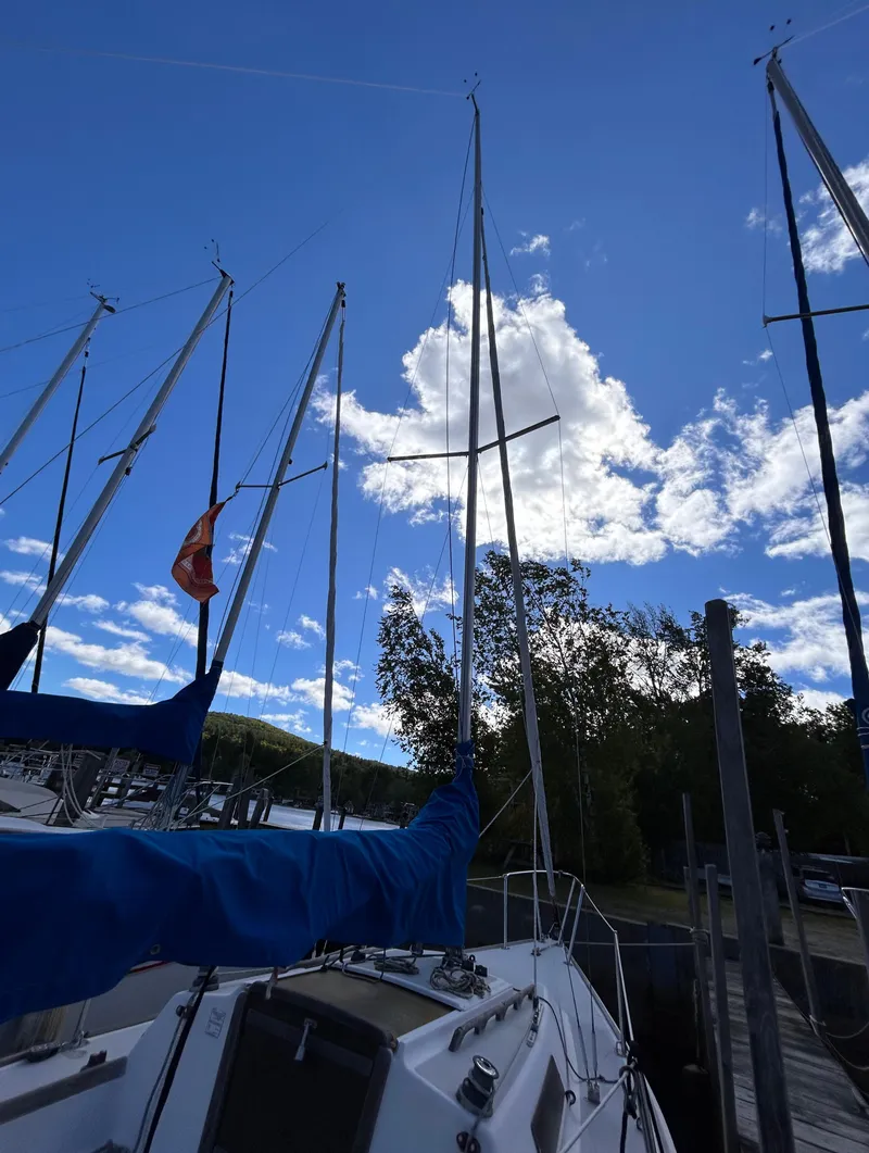 Slide: The Image of 1991 J Boats J/22 sailboat docked under a bright blue sky. - 5