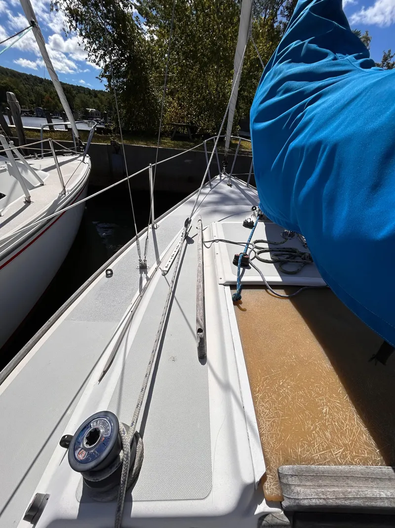 Slide: The Image of 1991 J Boats J/22 sailboat docked, featuring deck and rigging details. - 6