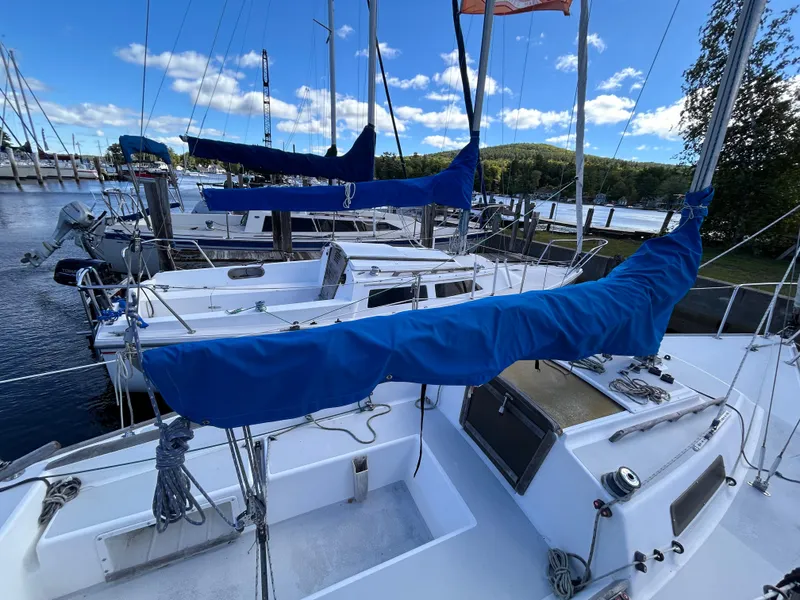 Slide: The Image of 1991 J Boats J/22 sailboat docked with blue sail covers. - 8