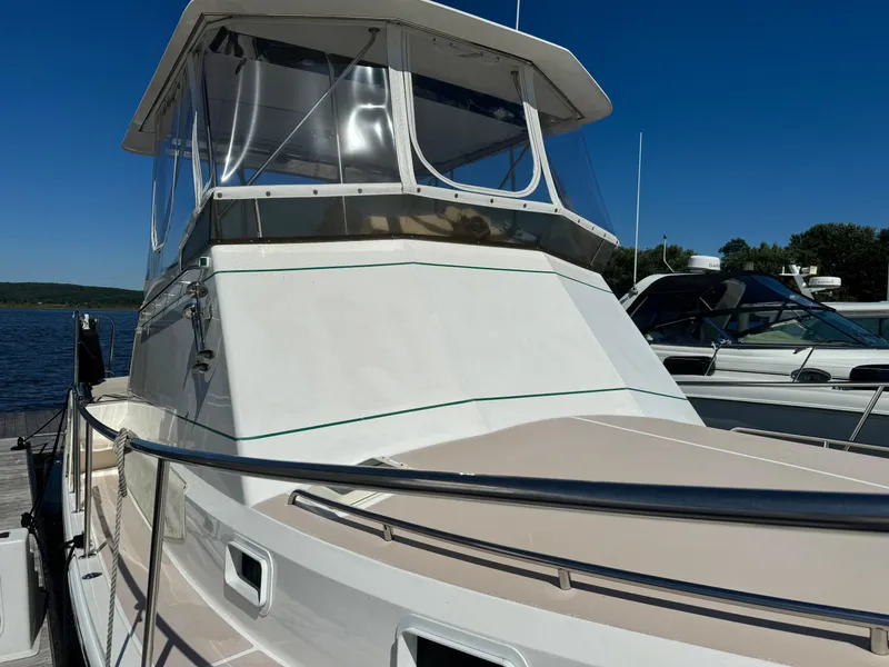 Slide: The Image of 2004 Nauset 33 boat docked under clear blue sky. - 21