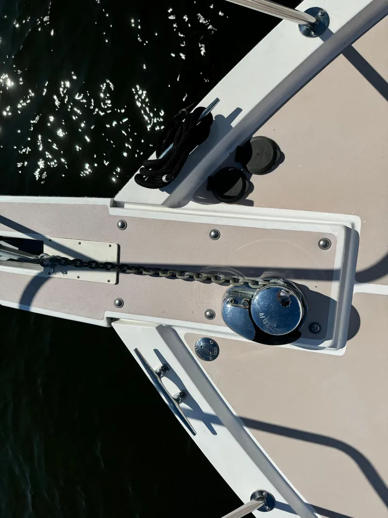 Slide: The Image of Bow of 2004 Nauset 33 boat with anchor chain and winch. - 22