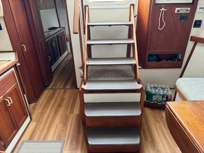 Slide: The Image of Interior of 2004 Nauset 33 boat with wooden stairs and cabin area. - 28