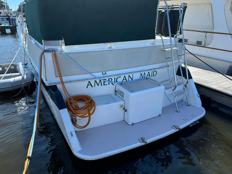 Slide: The Image of 2004 Nauset 33 boat named "American Maid" docked at marina. - 3