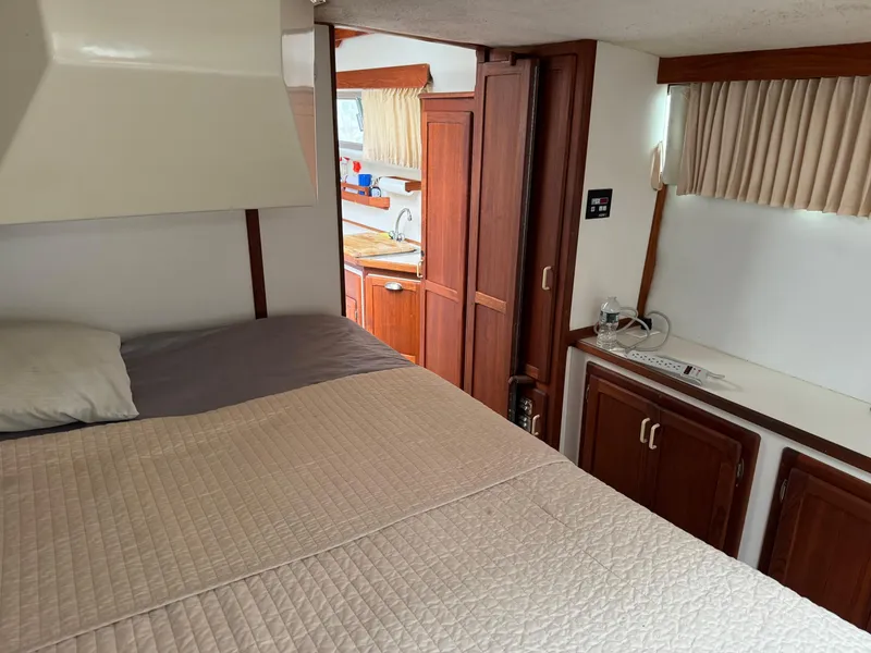 Slide: The Image of Interior of 2004 Nauset 33 boat with cozy bedroom and wooden cabinetry. - 38