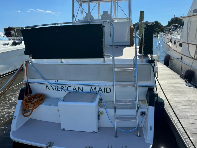 Slide: The Image of 2004 Nauset 33 boat named "American Maid" docked at a marina. - 4