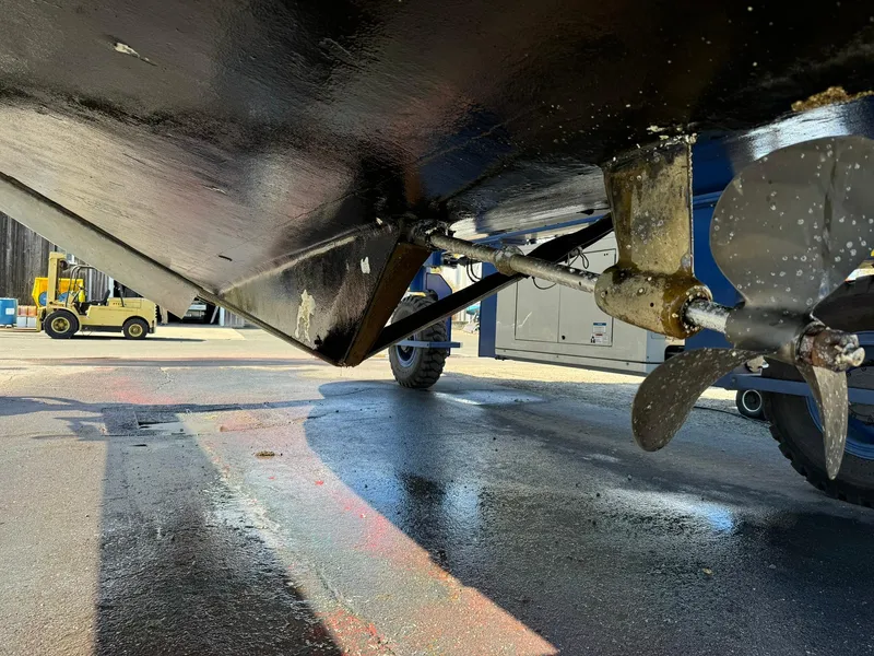 Slide: The Image of Underside view of a 2004 Nauset 33 boat with visible propeller and rudder. - 42