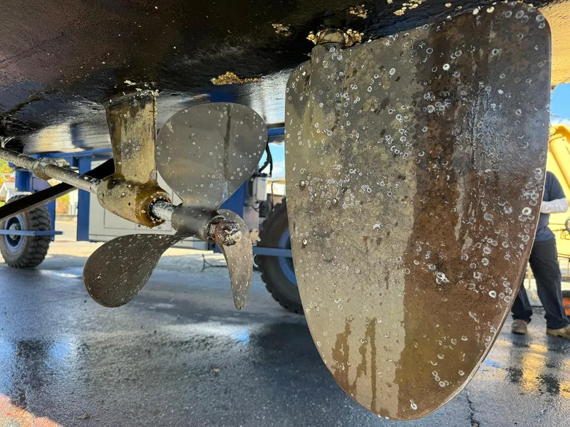 Slide: The Image of Close-up of a 2004 Nauset 33 boat propeller and rudder with marine growth. - 43