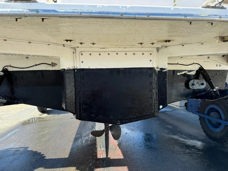 Slide: The Image of 2004 Nauset 33 boat stern with visible propeller and rudder. - 47