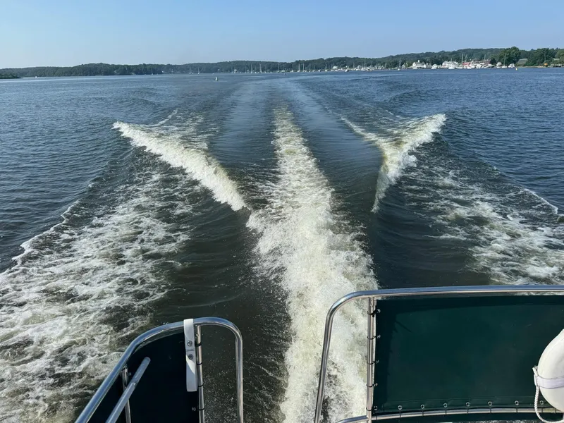 Slide: The Image of Wake of 2004 Nauset 33 Bridge Deck boat cruising on a calm lake. - 49