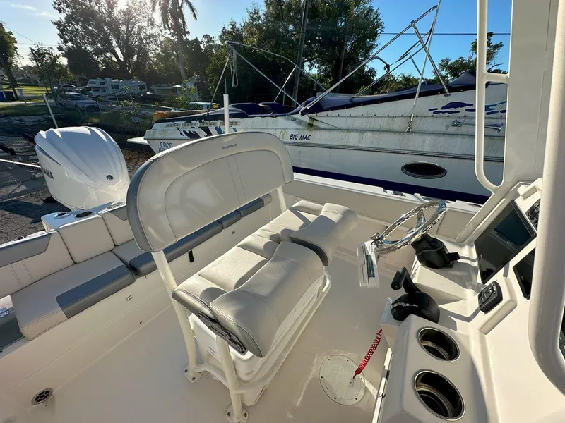 Slide: The Image of 2025 Sailfish 232 boat interior with seating and storage compartments. - 19