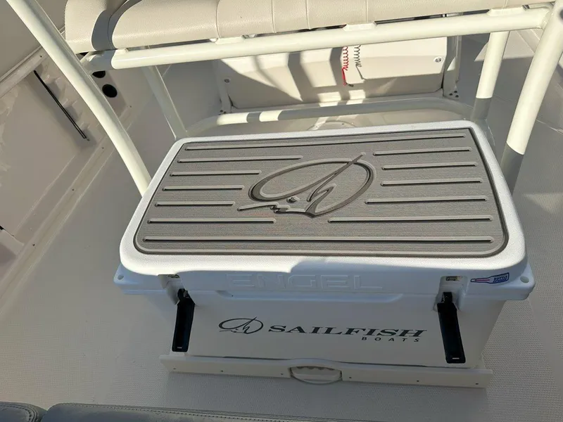 Slide: The Image of Open storage compartment on 2025 Sailfish 232 boat, showing interior details and wiring. - 24
