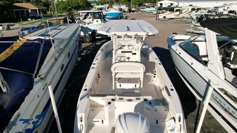 Slide: The Image of Open storage compartments on a 2025 Sailfish 232 boat deck. - 9