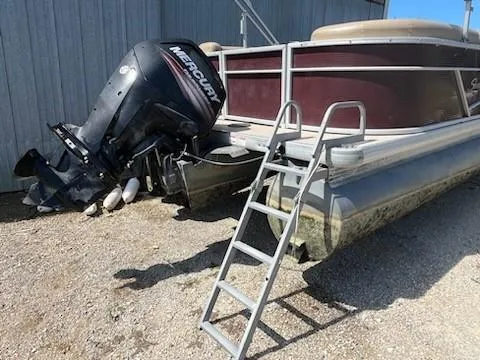 Slide: The Image of 2019 Sweetwater 2286SB pontoon boat with Mercury outboard motor and ladder. - 1