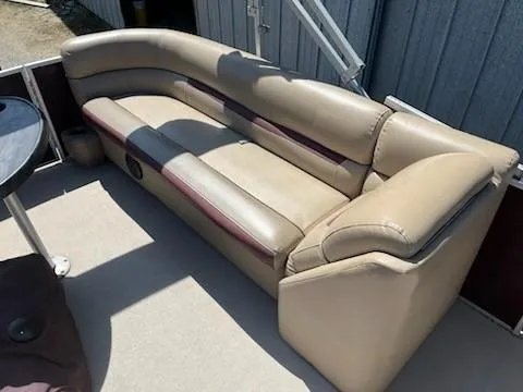 Slide: The Image of 2019 Sweetwater 2286SB boat seating, beige leather upholstery, outdoor setting. - 10