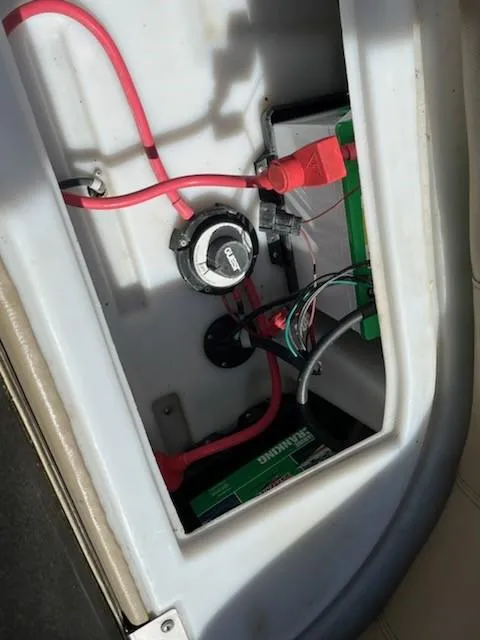 Slide: The Image of 2019 Sweetwater 2286SB boat battery compartment with wiring and connections. - 4