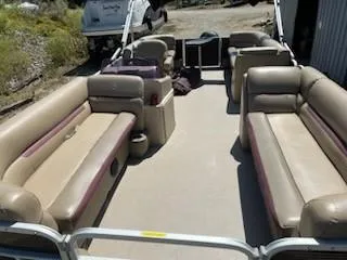 Slide: The Image of 2019 Sweetwater 2286SB pontoon boat with spacious seating and beige upholstery. - 5