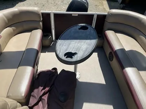 Slide: The Image of 2019 Sweetwater 2286SB pontoon boat interior with seating and table. - 6