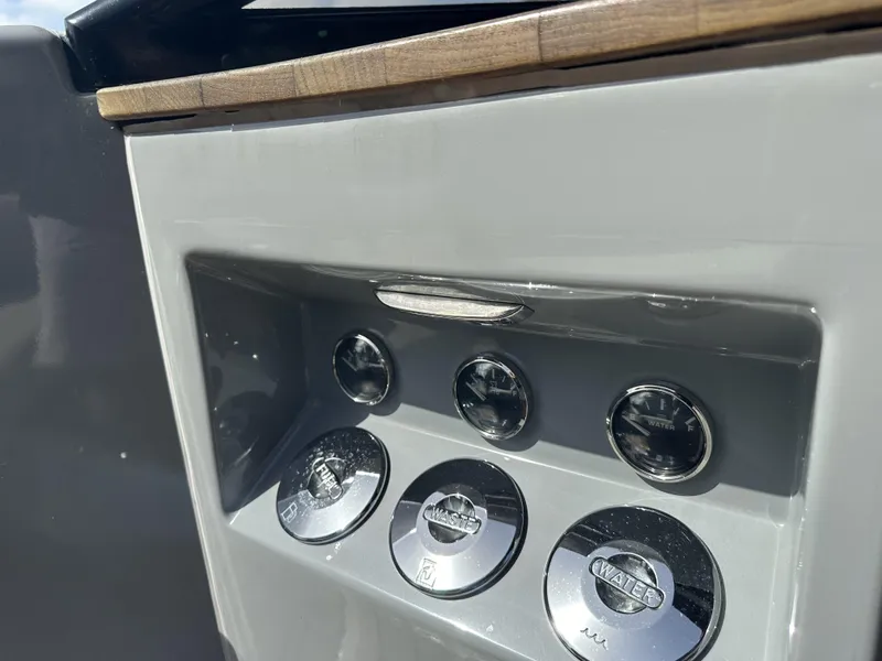 Slide: The Image of Control panel of 2021 Rand Leisure boat with gauges and switches. - 11