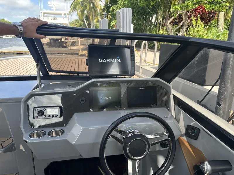 Slide: The Image of Cockpit of 2021 Rand Leisure boat with Garmin navigation system. - 13