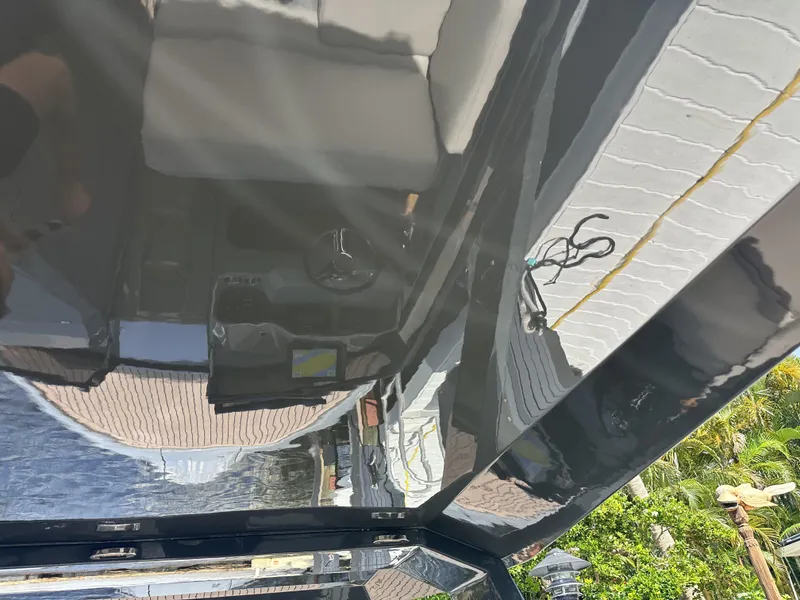 Slide: The Image of Interior view of a 2021 Rand Leisure boat with seating and control panel. - 19