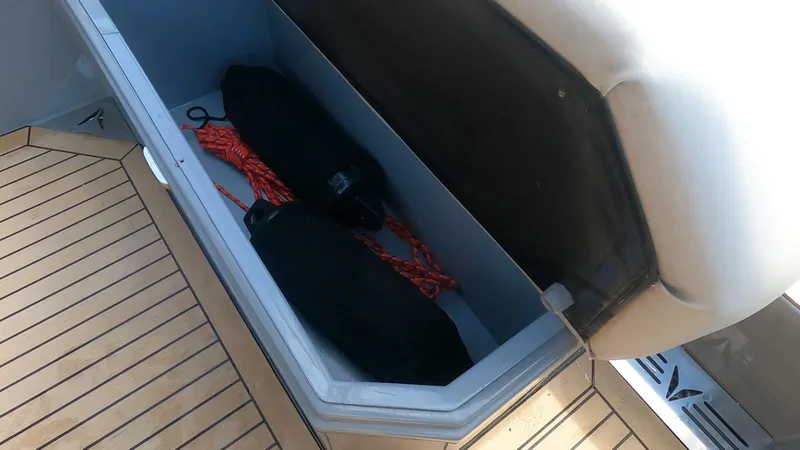 Slide: The Image of Storage compartment on a 2021 Rand Leisure boat with ropes and equipment. - 34