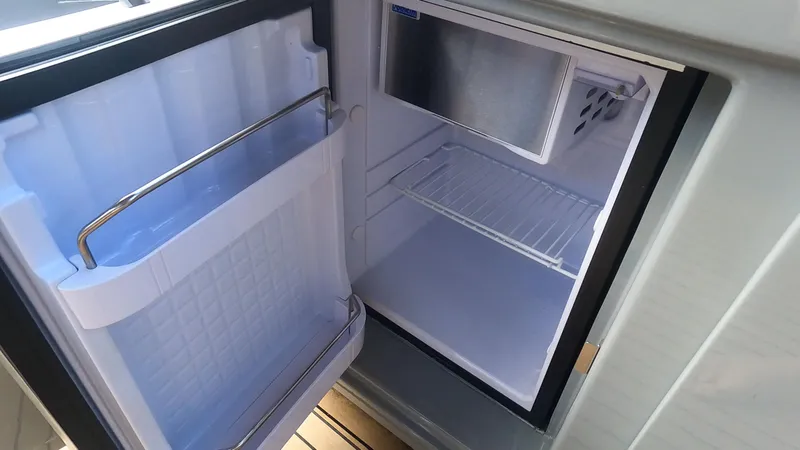 Slide: The Image of Open Rand Leisure 2021 refrigerator with empty shelves and door storage. - 38