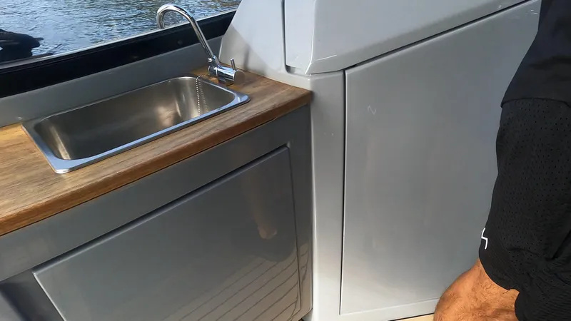 Slide: The Image of Modern boat kitchen with stainless steel sink and wooden countertop, Rand Leisure 2021 model. - 41