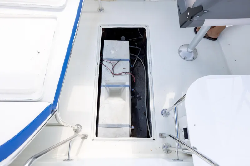 Slide: The Image of Open hatch on 1983 Bertram 28 Moppie boat deck, revealing internal components. - 20