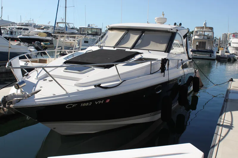 Slide: The Image of 2012 Regal 35 Sport Coupe yacht docked in marina. - 0