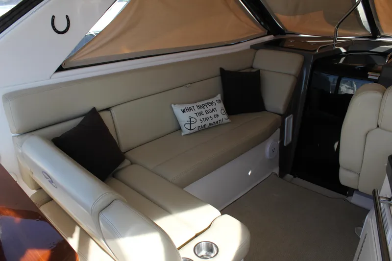 Slide: The Image of Interior of 2012 Regal 35 Sport Coupe with beige seating and decorative pillows. - 19